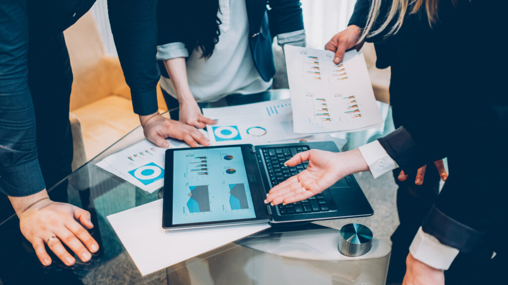Team reviewing performance review to avoid common marketing mistakes