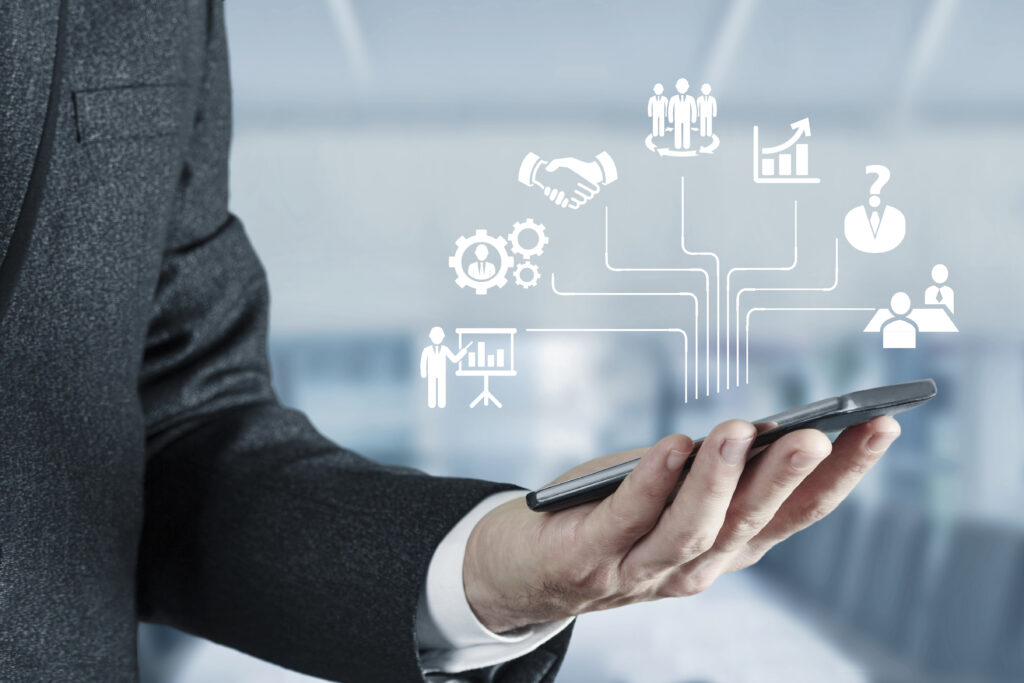 A man holding a phone with symbol of customer data.